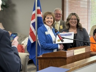 PIP Gudrun Yngvadottir presenting Lion Misty with her membership certificate