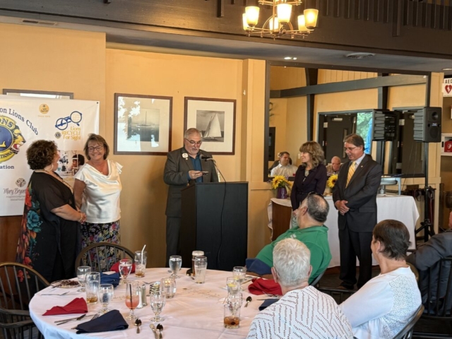 new member initiation, sponsor Karla with new member Teresa, inducting official PCC Darren, new member Leann with sponsor Craig